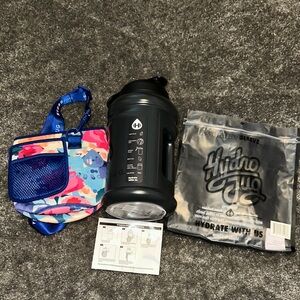 Black 73oz HydroJug water bottle with Sleeve and Strap. 
New with tags.